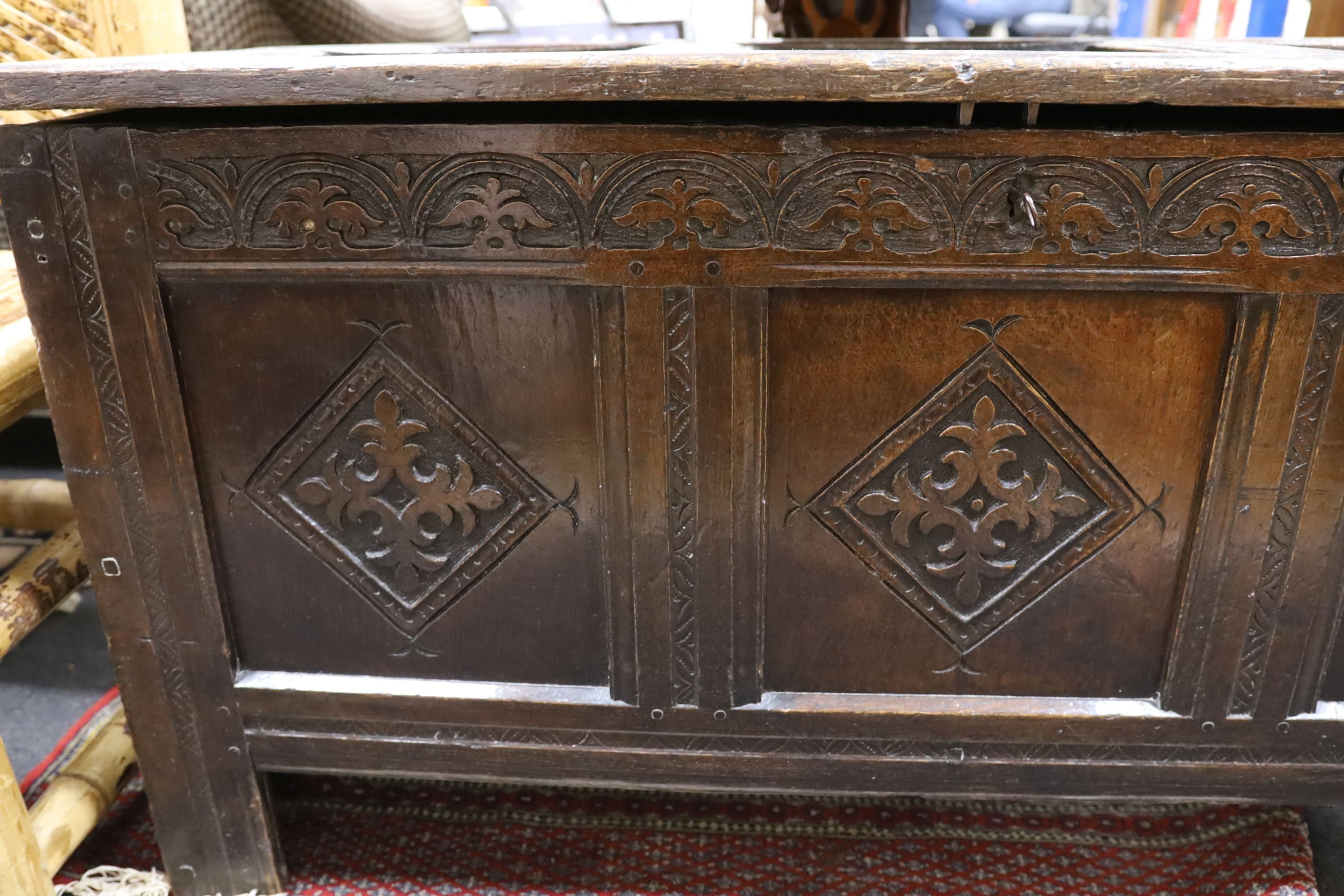 A late 17th century carved oak coffer, length 134cm, depth 54cm, height 68cm